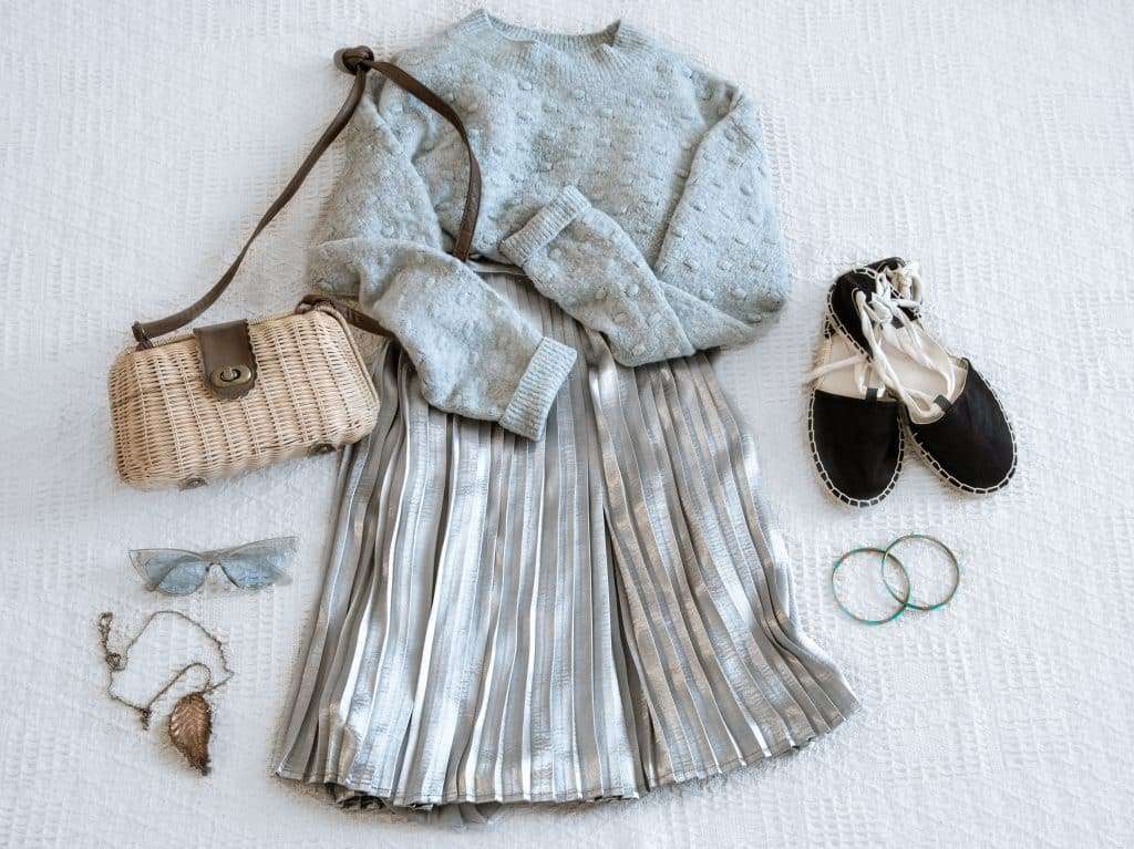 Set with fashionable women's clothing skirt and sweater.